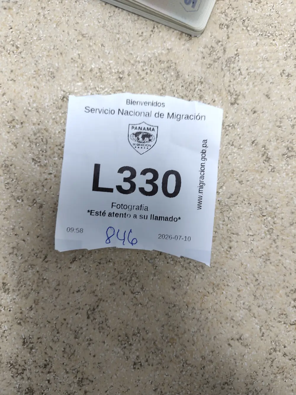 Queue ticket L330, Fotografía counter, Servicio Nacional de Migración
